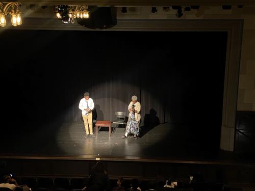 Scholar performing a play